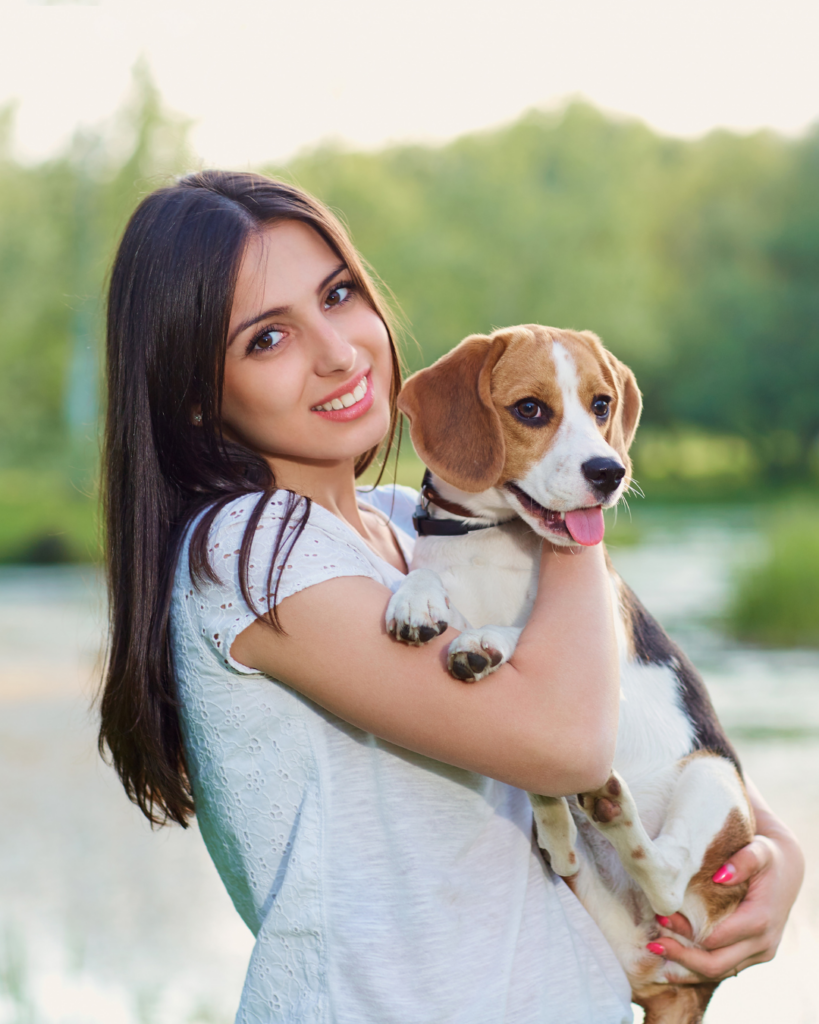 Woman holding a beagle